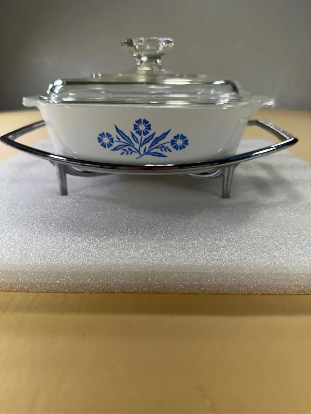 Corning, ware casserole, dish, glass lid, and chrome trivet